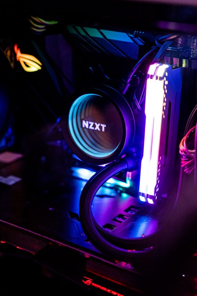 a close up of a computer with a neon light